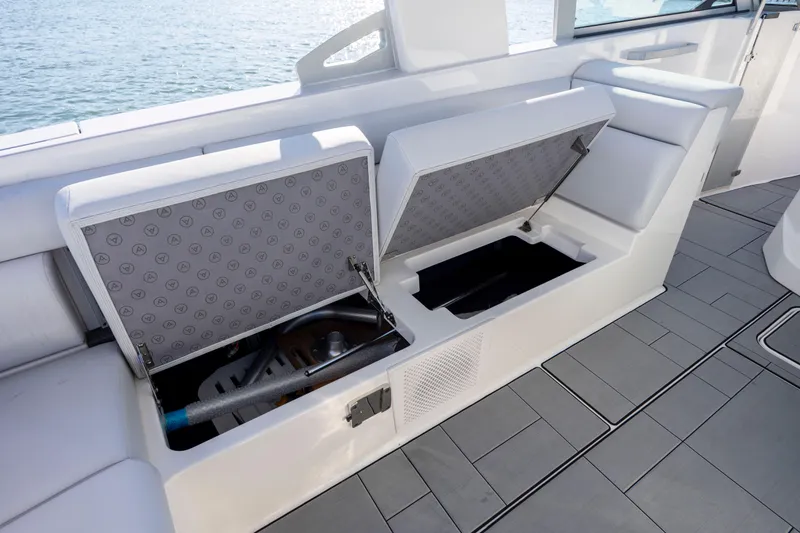 Slide: The Image of 2023 Aviara AV32 OB boat with open storage compartments on deck. - 28