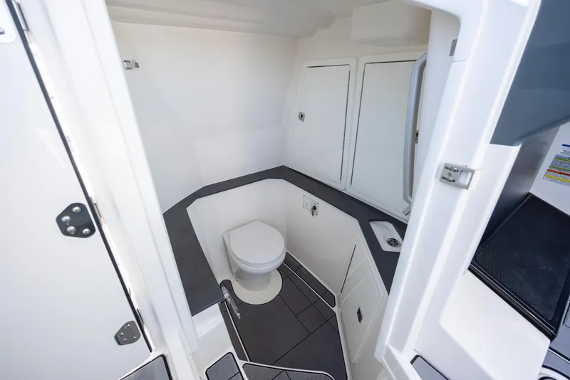 Slide: The Image of 2023 Aviara AV32 OB boat interior bathroom with toilet and sink. - 30