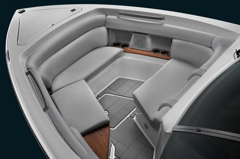 Slide: The Image of 2023 Aviara AV32 OB boat cruising on a calm waterfront with docks in the background. - 4