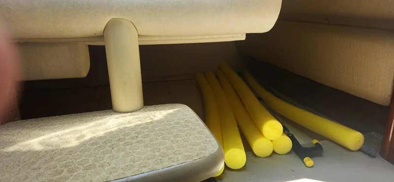 Slide: The Image of Yellow pool noodles stored under seat on 2008 Sea Ray 260 Sundancer boat. - 25
