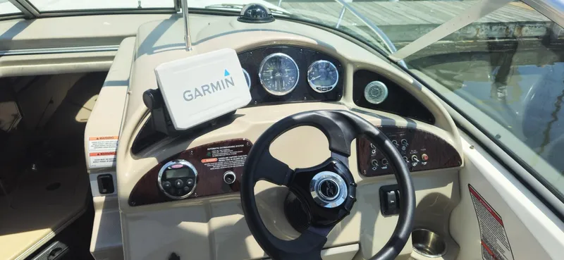 Slide: The Image of Cockpit of 2008 Sea Ray 260 Sundancer with Garmin navigation system and steering wheel. - 6