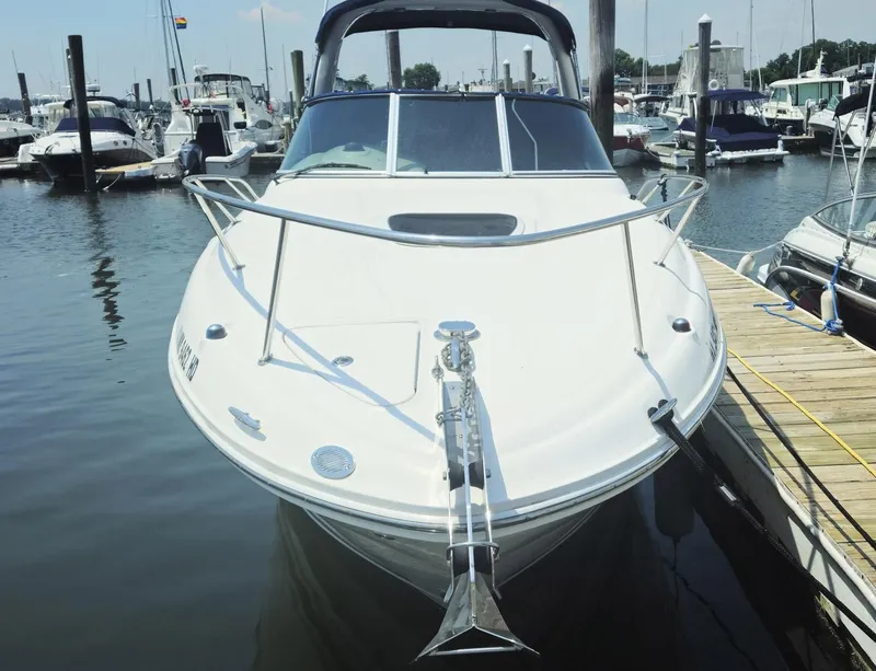 Slide: The Image of 2008 Sea Ray 260 Sundancer docked at marina, front view. - 3
