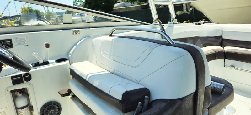 Slide: The Image of Interior of a 1999 Cobalt 293 boat with white and brown seating. - 6