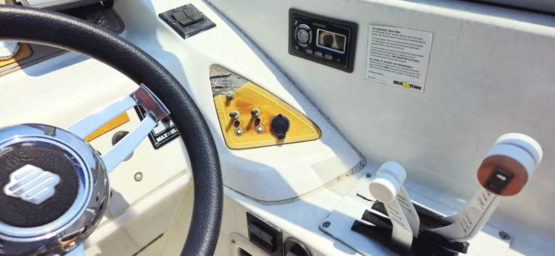 Slide: The Image of 1999 Cobalt 293 boat dashboard with steering wheel, controls, and Kenwood audio system. - 4