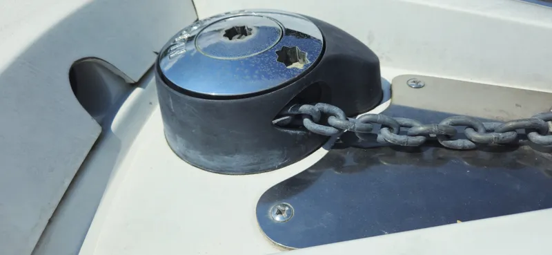 Slide: The Image of Anchor chain mechanism on a 1999 Cobalt 293 boat deck. - 11