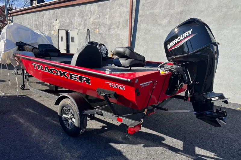 Slide: The Image of 2026 Tracker Pro Team 175 boat with Mercury engine, parked outdoors. - 49