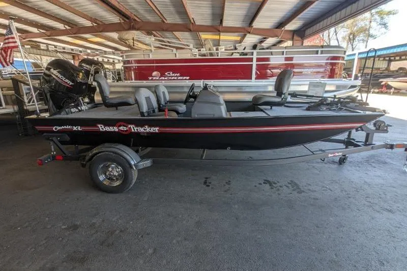 The Image of 2026 Tracker Bass Tracker Classic XL boat in a covered storage area. - 0