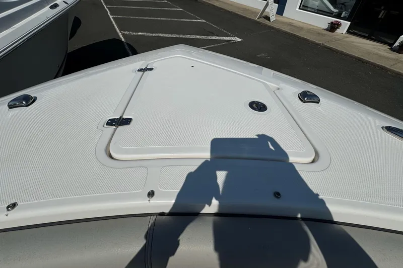 Slide: The Image of 2024 Pursuit S 328 Sport boat deck with storage hatch and hardware. - 17