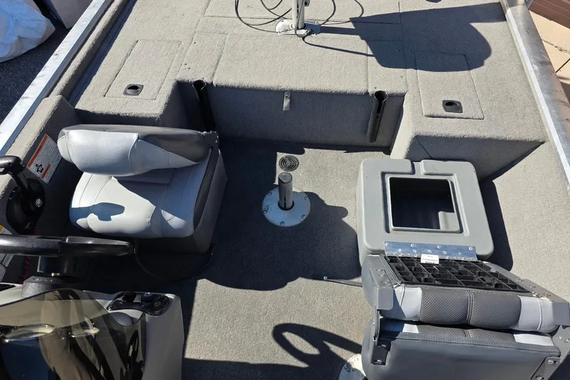 Slide: The Image of 2010 Bass Tracker Pro Crappie 175 boat interior with seating and storage compartments. - 12