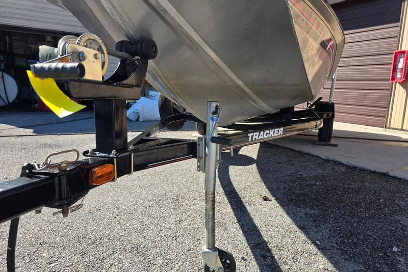 Slide: The Image of 2010 Bass Tracker Pro Crappie 175 boat on trailer, parked outdoors. - 17