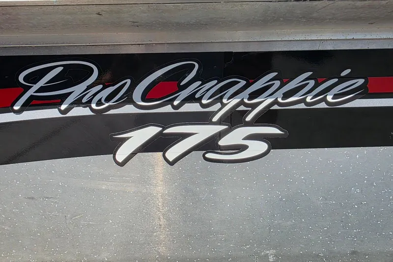 Slide: The Image of 2010 Bass Tracker Pro Crappie 175 boat logo with red and black accents. - 2