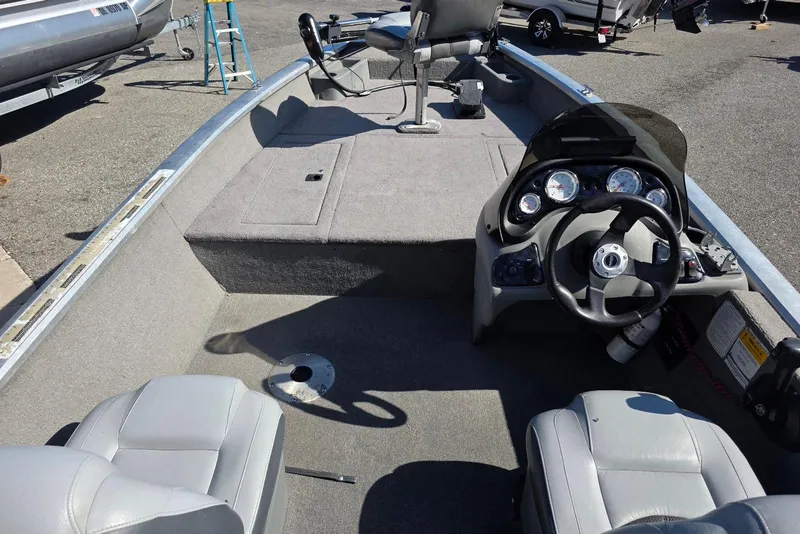 Slide: The Image of 2010 Bass Tracker Pro Crappie 175 boat interior with steering console and seating. - 6
