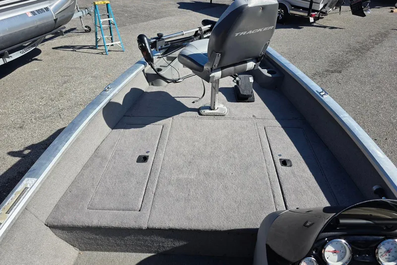 Slide: The Image of 2010 Bass Tracker Pro Crappie 175 boat interior with steering console and seating. - 7