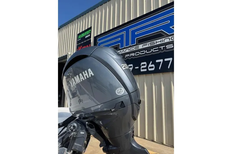 Slide: The Image of 2025 NauticStar 214 Shallow Bay with Yamaha outboard motor at dealership. - 5