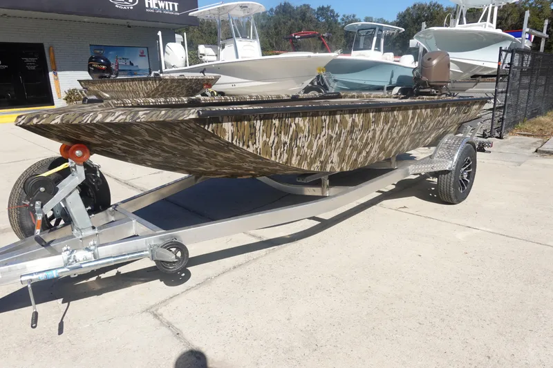 Slide: The Image of 2026 Avid 16 Commander boat with camouflage design on a trailer. - 13