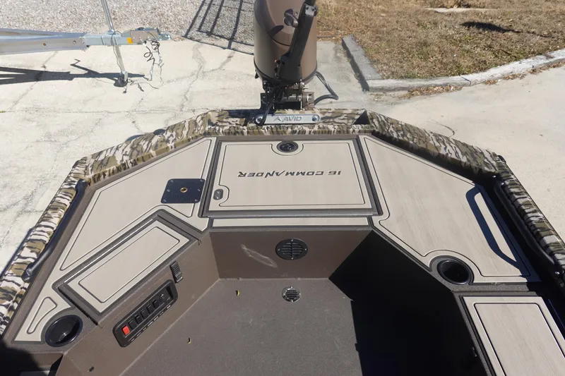 Slide: The Image of 2026 Avid 16 Commander boat interior with camouflage design and storage compartments. - 21