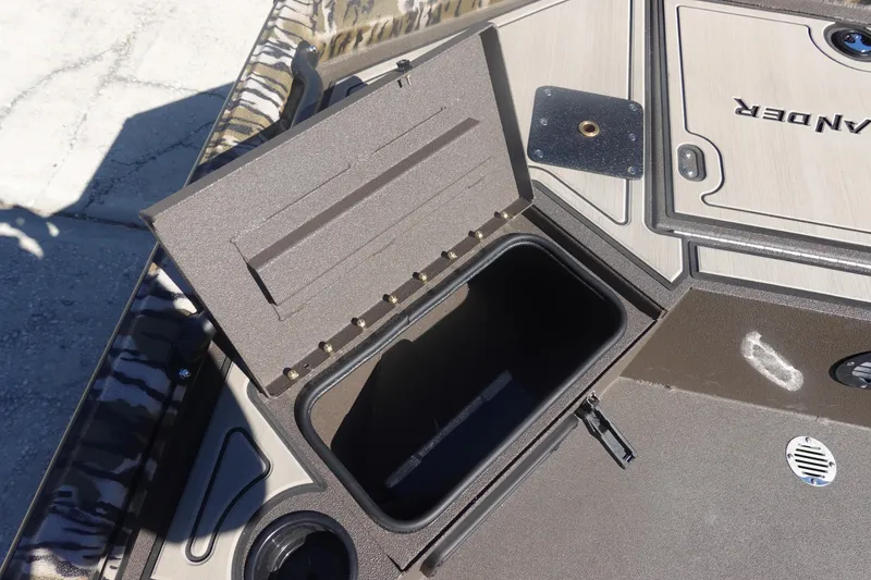 Slide: The Image of Open storage compartment on 2026 Avid 16 Commander boat deck. - 22