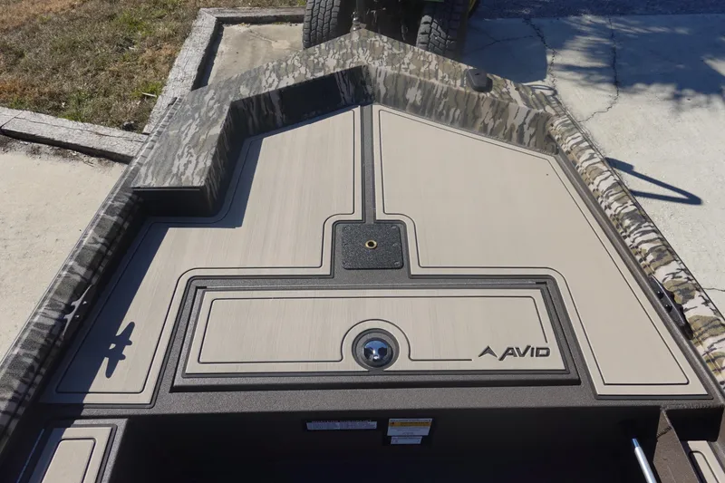 Slide: The Image of Avid 16 Commander 2026 boat deck with camouflage design and logo. - 27