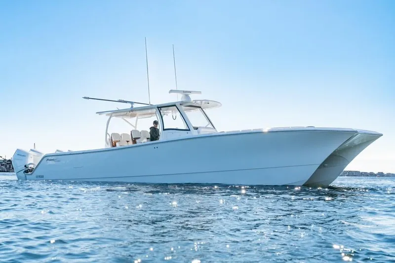 The Image of 2025 Front Runner 43 Catamaran cruising on calm blue waters under clear sky. - 0