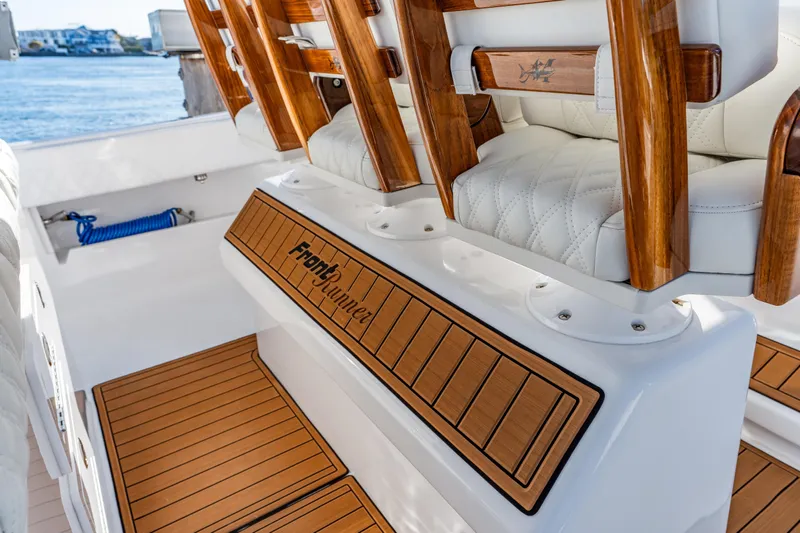 Slide: The Image of 2025 Front Runner 43 Catamaran interior with teak flooring and luxurious seating. - 11