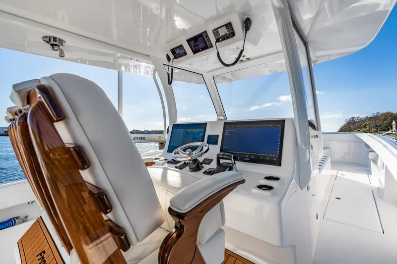 Slide: The Image of Interior of 2025 Front Runner 43 Catamaran with advanced navigation systems and luxurious seating. - 14