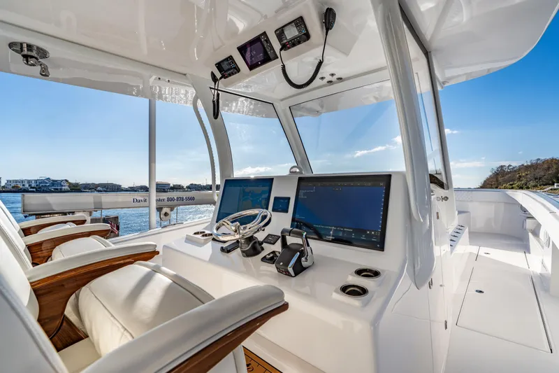 Slide: The Image of Luxurious helm of 2025 Front Runner 43 Catamaran with advanced navigation systems. - 15