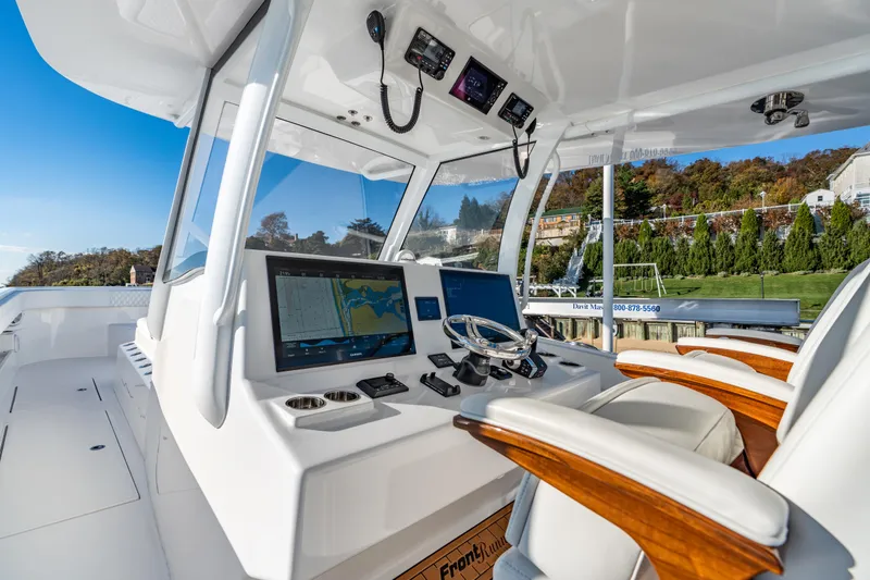 Slide: The Image of Cockpit of 2025 Front Runner 43 Catamaran with advanced navigation systems and luxurious seating. - 18