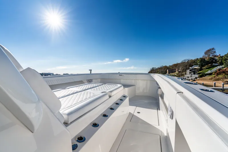 Slide: The Image of Luxurious 2025 Front Runner 43 Catamaran deck under clear blue sky and bright sun. - 21