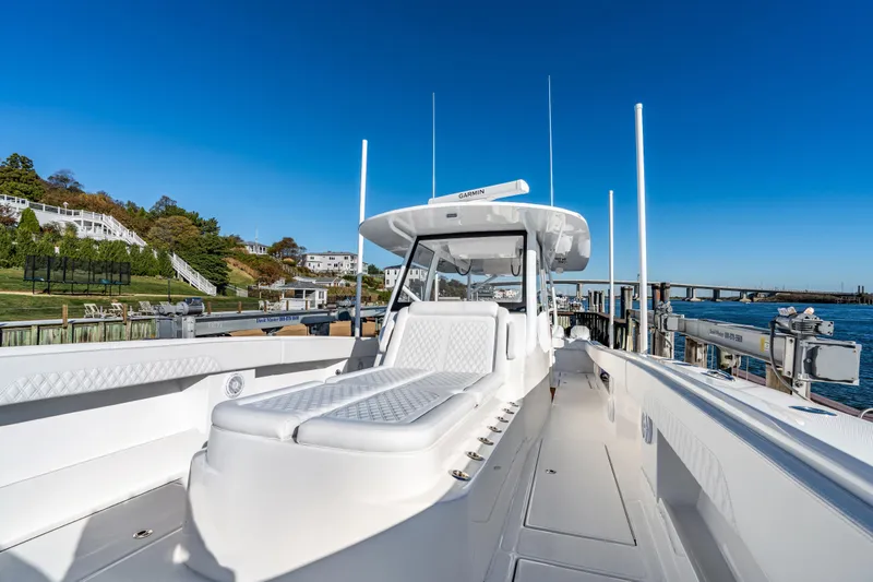 Slide: The Image of 2025 Front Runner 43 Catamaran docked, showcasing sleek design and spacious deck. - 23
