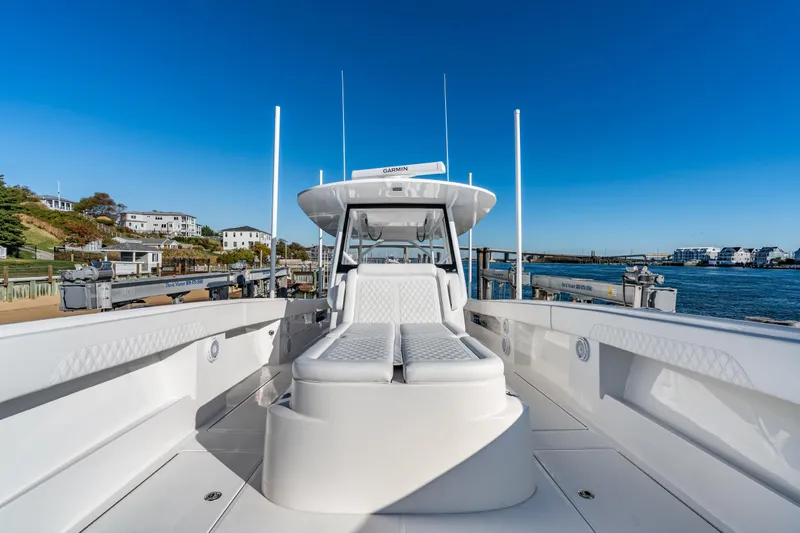Slide: The Image of 2025 Front Runner 43 Catamaran docked, showcasing sleek design and spacious deck. - 24