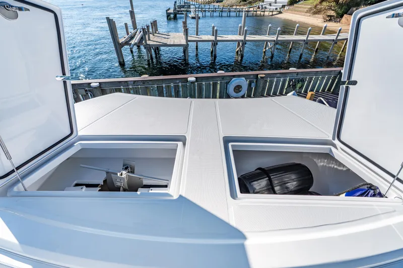Slide: The Image of Open storage compartments on 2025 Front Runner 43 Catamaran, dockside view. - 28