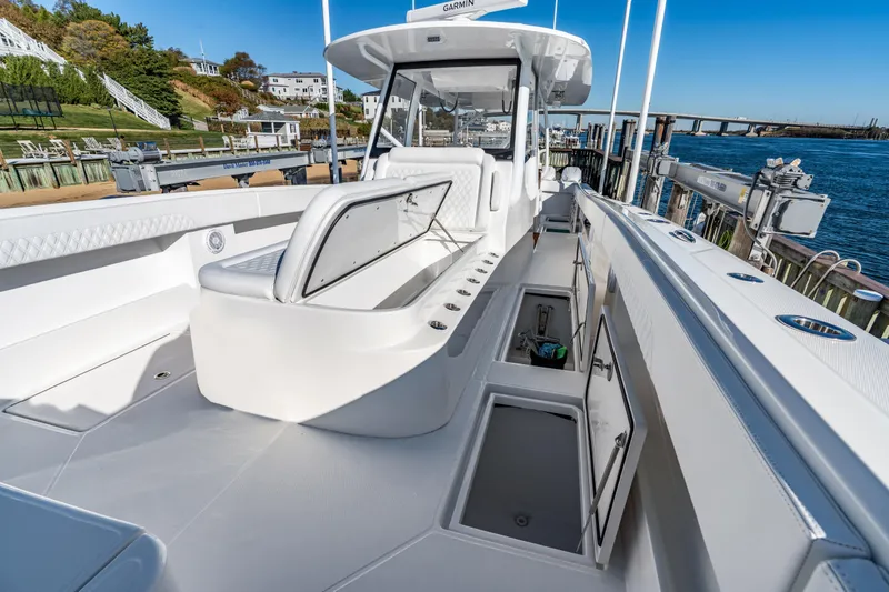 Slide: The Image of 2025 Front Runner 43 Catamaran docked, showcasing spacious deck and storage compartments. - 29