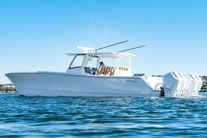 Slide: The Image of 2025 Front Runner 43 Catamaran on water, featuring sleek design and powerful engines. - 3