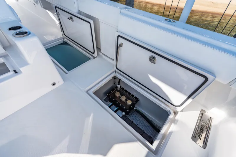 Slide: The Image of 2025 Front Runner 43 Catamaran deck with open storage compartments. - 30