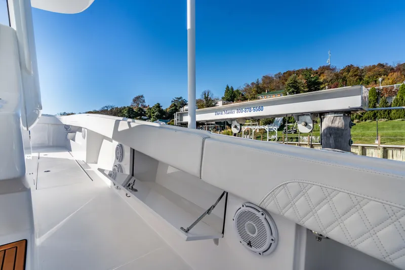 Slide: The Image of 2025 Front Runner 43 Catamaran deck with white seating and clear blue sky. - 32