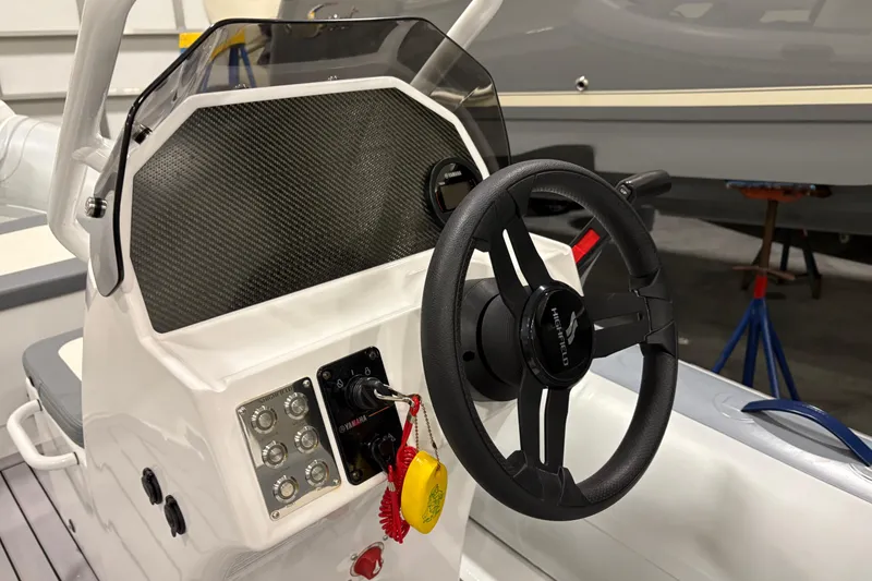 Slide: The Image of Steering console of 2025 Highfield Classic 400 boat with Yamaha controls. - 10