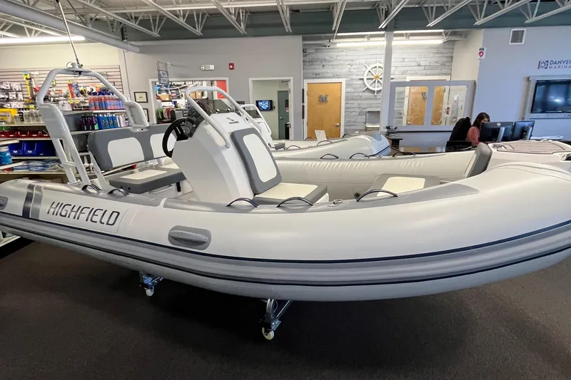 Slide: The Image of 2025 Highfield Classic 400 inflatable boat displayed in a showroom. - 13
