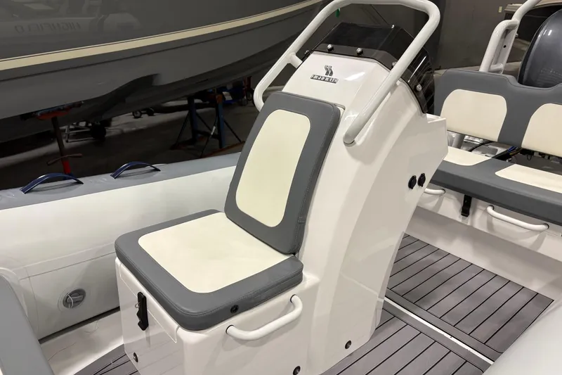 Slide: The Image of 2025 Highfield Classic 400 boat interior with cushioned seating and sleek design. - 7