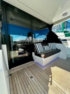 Slide: The Image of Interior view of Galeon 425 HTS yacht, overlooking deck and nature. - 2