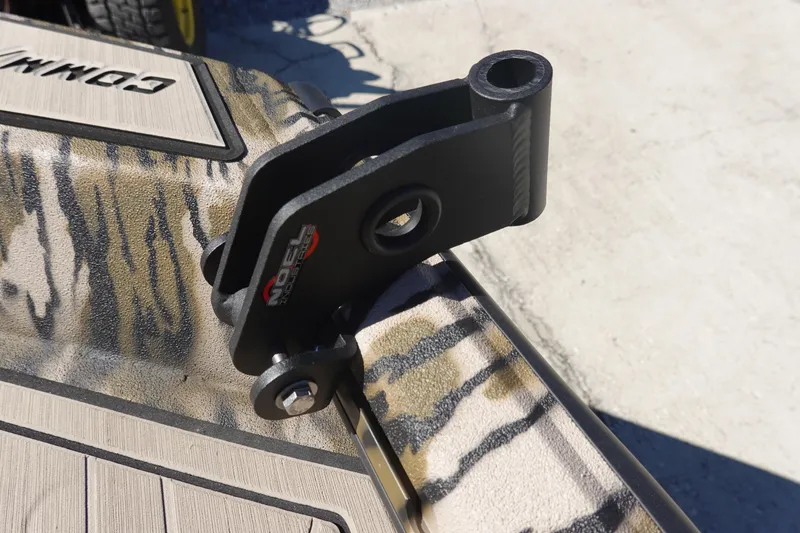 Slide: The Image of Avid 18 Commander 2026 boat with camo pattern and metal bracket detail. - 35