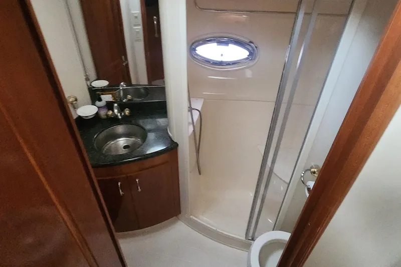 Slide: The Image of Bathroom interior of 2005 Carver 466 Motor Yacht with sink, shower, and toilet. - 15