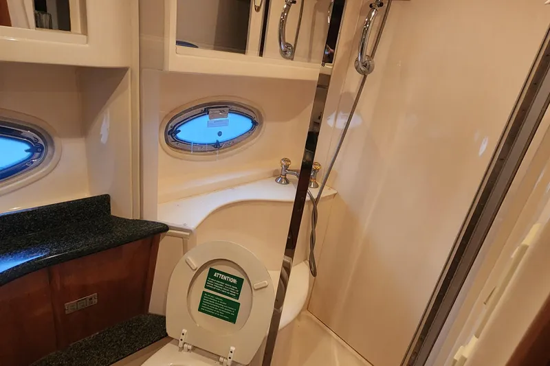 Slide: The Image of Bathroom interior of 2005 Carver 466 Motor Yacht with shower and porthole window. - 24