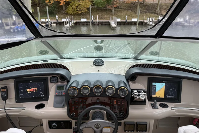 Slide: The Image of Helm of 2005 Carver 466 Motor Yacht with navigation screens and controls. - 3