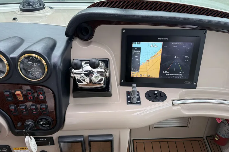Slide: The Image of 2005 Carver 466 Motor Yacht dashboard with navigation screen and controls. - 6