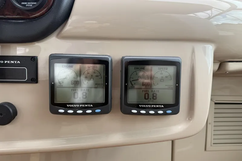 Slide: The Image of Volvo Penta engine display on 2005 Carver 466 Motor Yacht dashboard, showing RPM and fuel rate. - 7