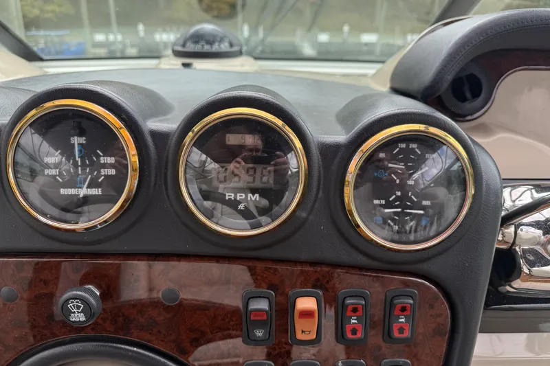 Slide: The Image of Dashboard of a 2005 Carver 466 Motor Yacht with gauges and controls. - 9