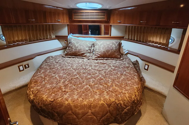 Slide: The Image of Luxurious bedroom interior of 2005 Carver 466 Motor Yacht with elegant bedding. - 17