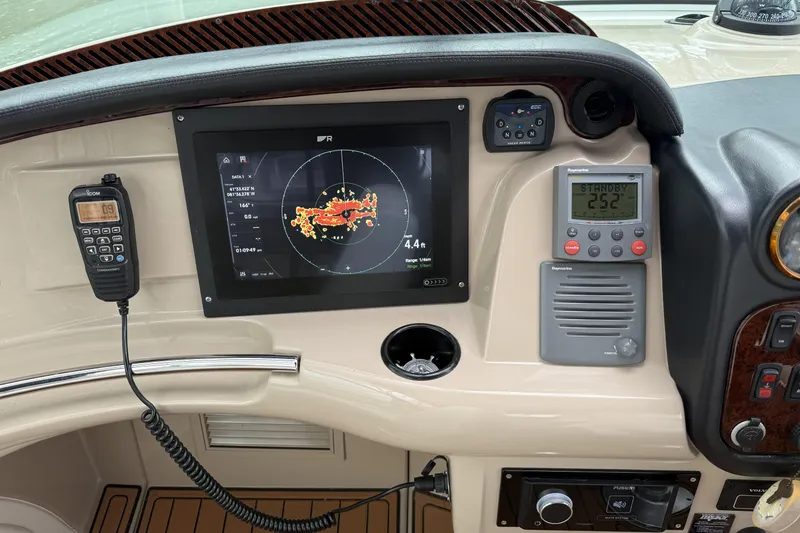 Slide: The Image of Control panel of a 2005 Carver 466 Motor Yacht with navigation and communication equipment. - 4