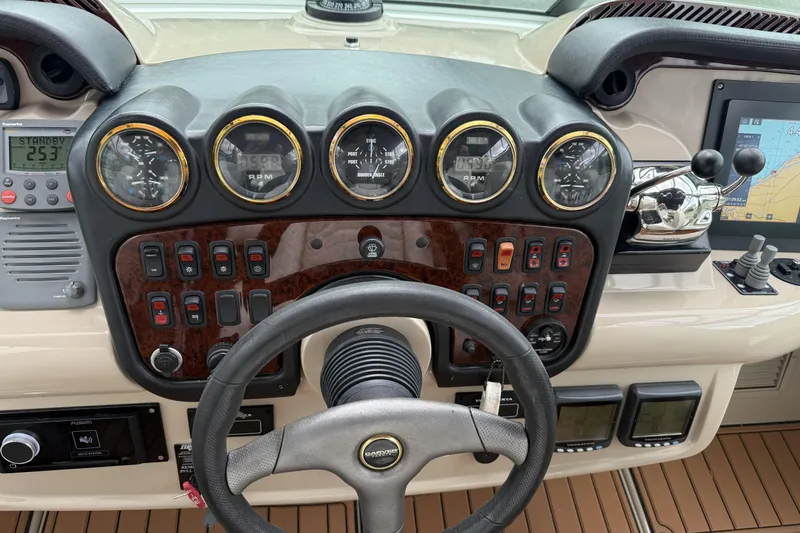Slide: The Image of 2005 Carver 466 Motor Yacht dashboard with gauges, controls, and navigation equipment. - 5