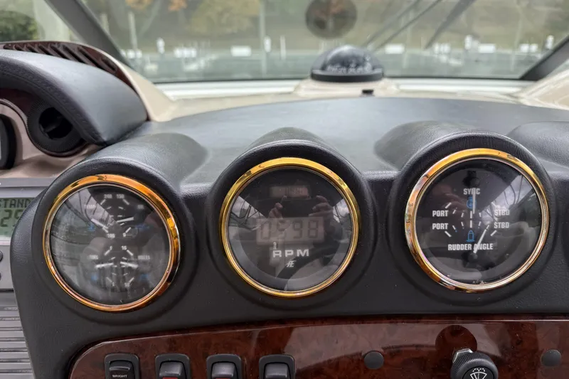 Slide: The Image of Dashboard of a 2005 Carver 466 Motor Yacht with gauges and controls. - 8